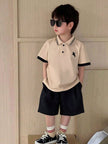 Classic Boys Beige Polo And Black Shorts For Sharp Style